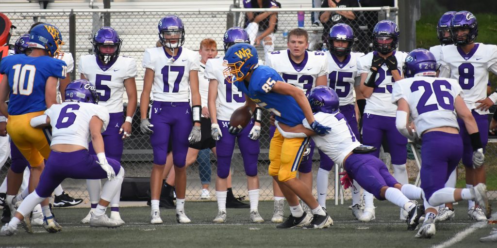 Wheat Ridge receiver fights for extra yards near Arvada West's sideline.