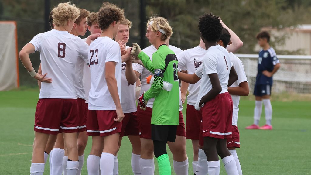 Thomas MacLaren boys soccer huddle