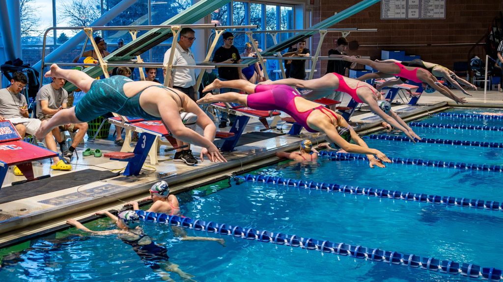 Girls Swimming and Diving start blocks relay