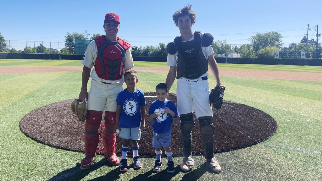 Children's Hospital First Pitch - Zeke and Zane with Cherry Creek and Regis Jesuit catchers