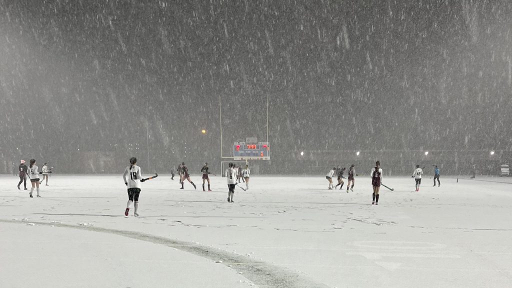 Snowy field hockey game