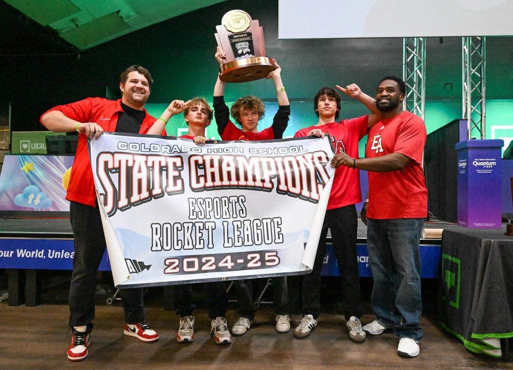 Team photo of Denver East after winning the Rocket League state championship.