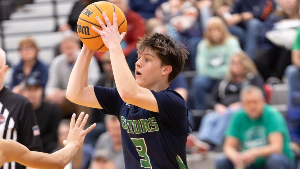 Standley Lake boys basketball player looks to pass.