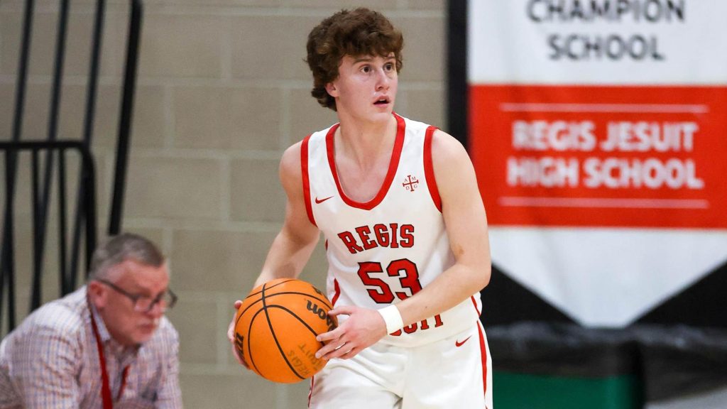 A Regis Jesuit player looks to pass.