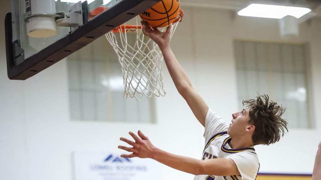 Ethan Tesman of Elbert shoots a layup at the rim