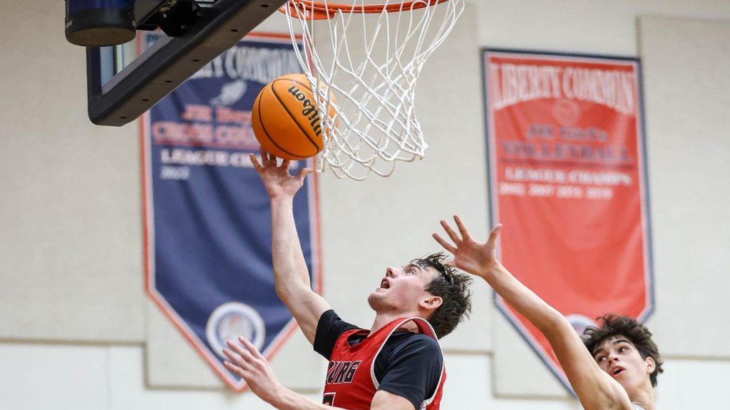 Tyce Bollers of Strasburg shoots a layup.