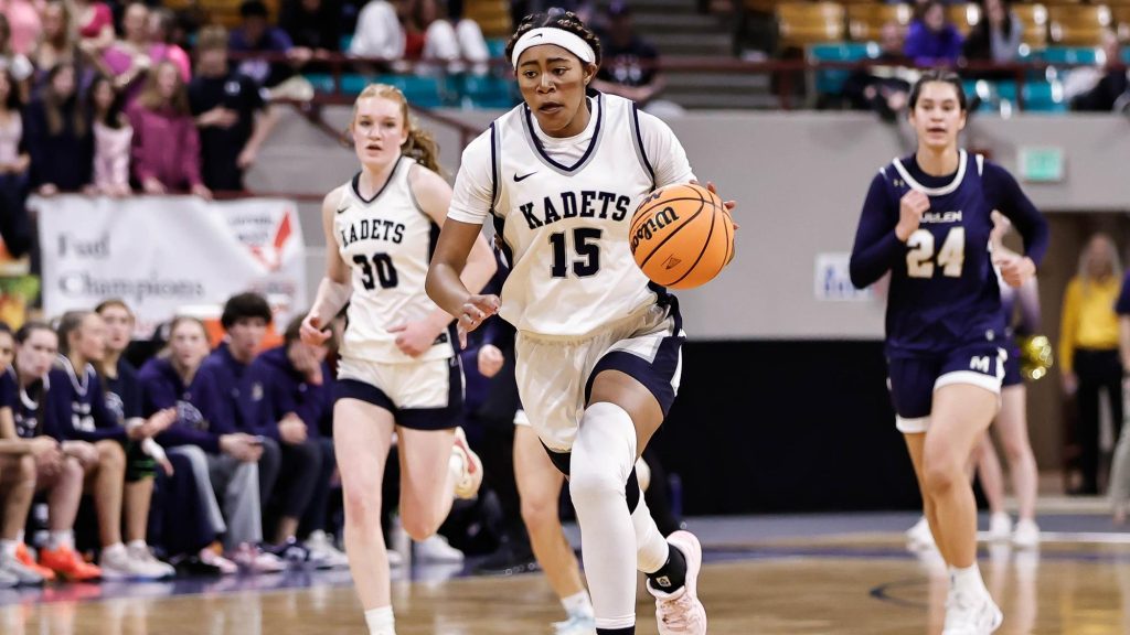 Tatyonna Brown of Air Academy dribbling.