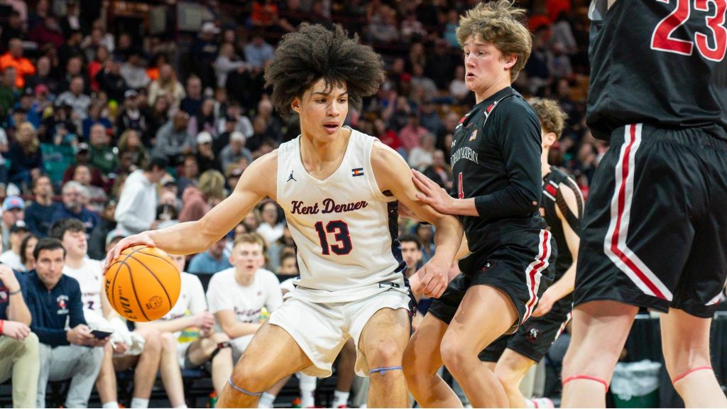 Caleb Fay dribbles near the basket.