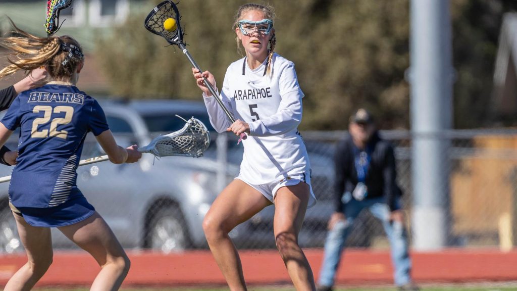 Julianne Dail controls the ball while playing lacrosse