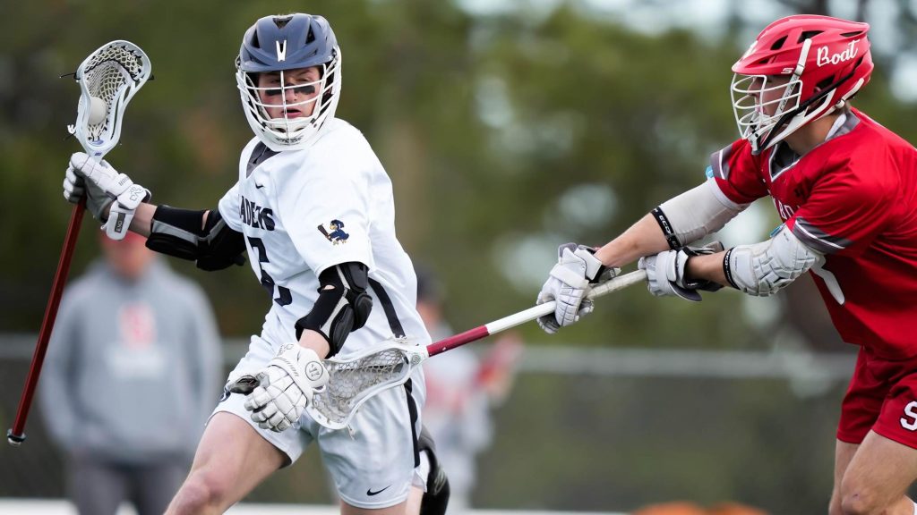 Lucas Obringer of the Air Academy lacrosse team controls the ball