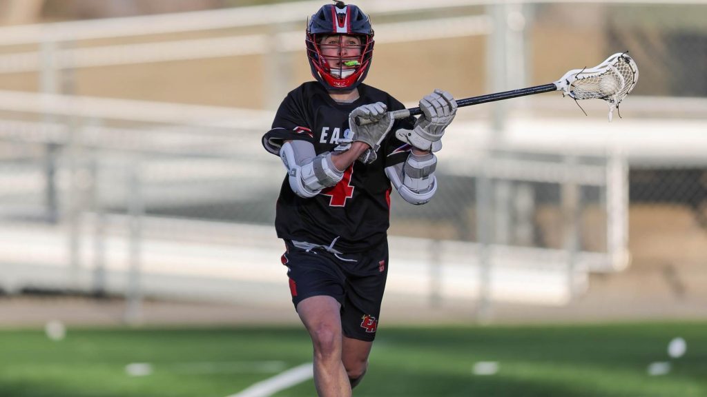 Jake Renschen of Denver East playing lacrosse