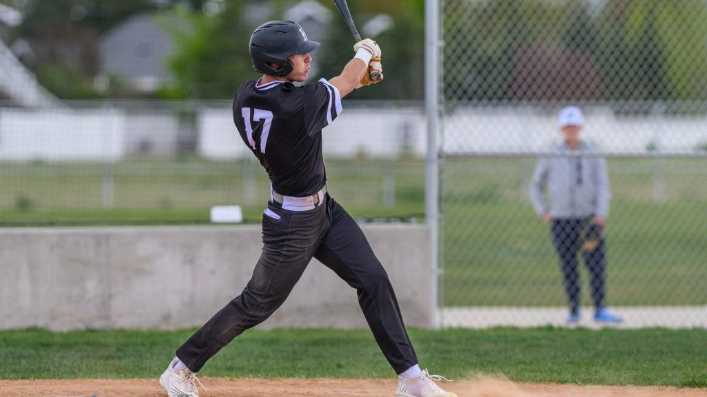 Sawyer Morgan of Highland swinging a bat