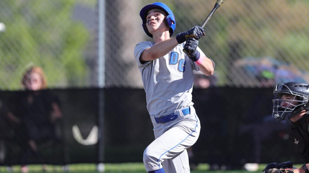 Mason Reilly of Denver Christian swinging a baseball bat