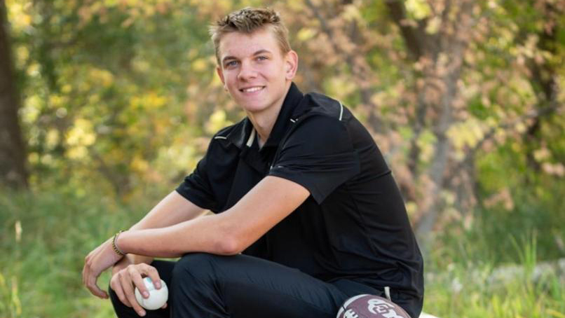 Simon Lunsford poses for a senior portrait