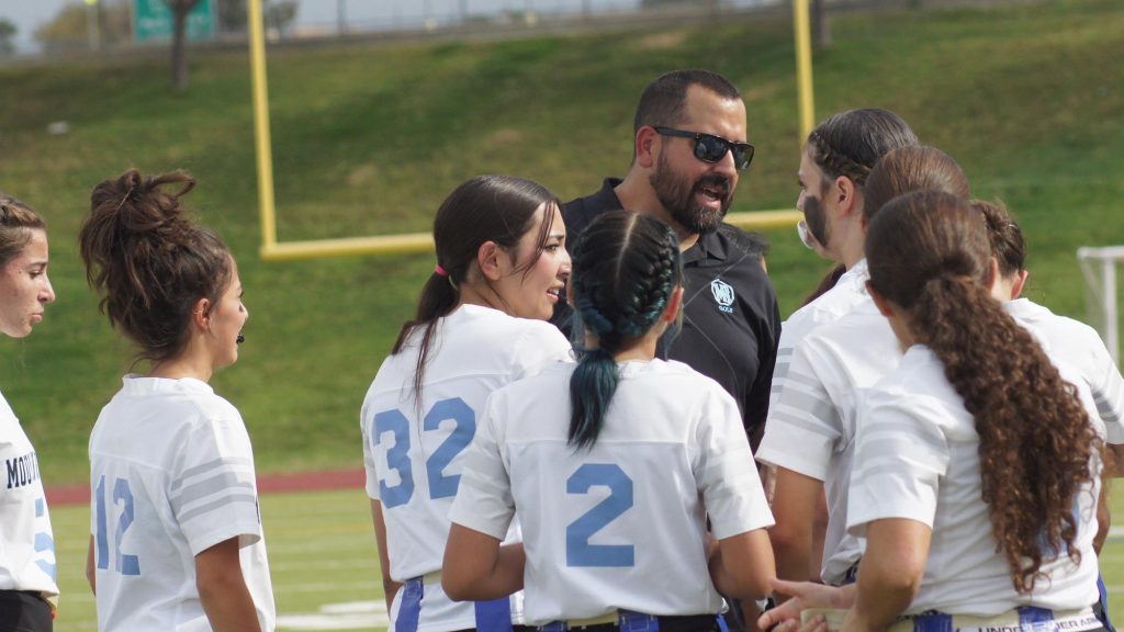 Coach Duane Tyler of Moutain Range talks to his flag football team
