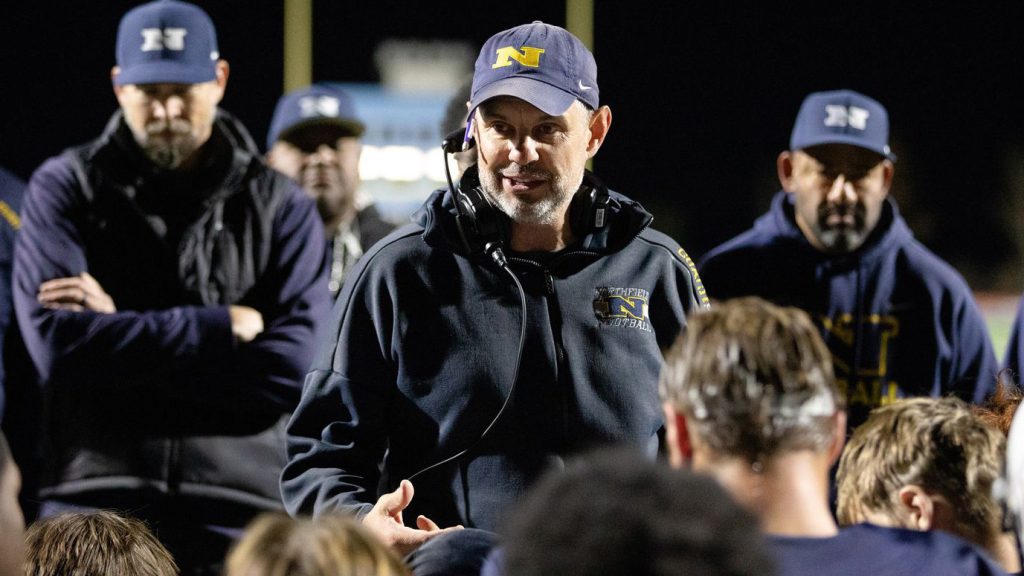 Ben Startzer of Northfield talking to his football team