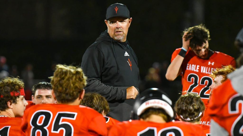 Eagle Valley football coach Chris Lake talks to his team