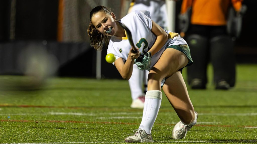 A Pine Creek player playing field hockey