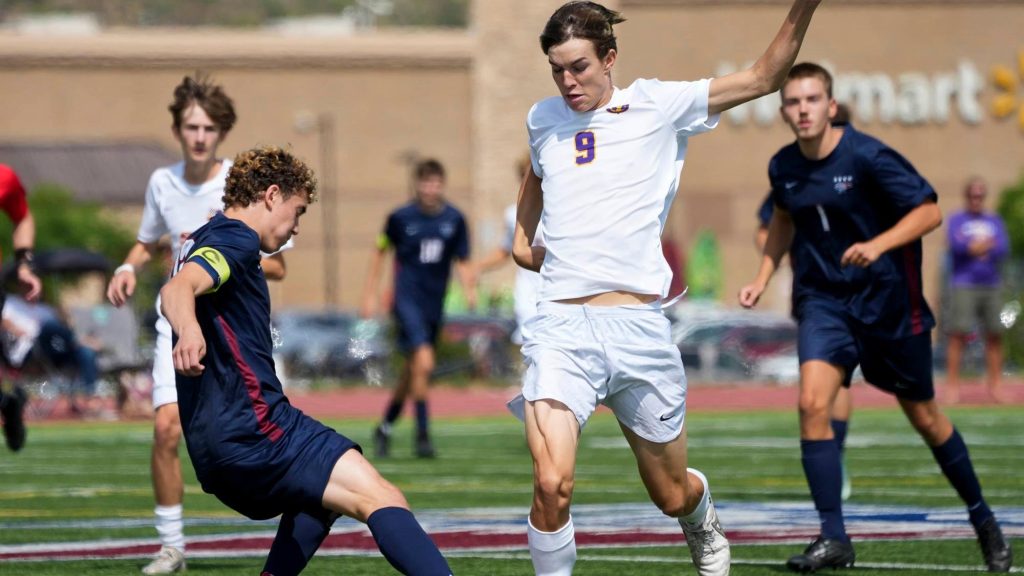 Owen Clough of Denver North playing soccer