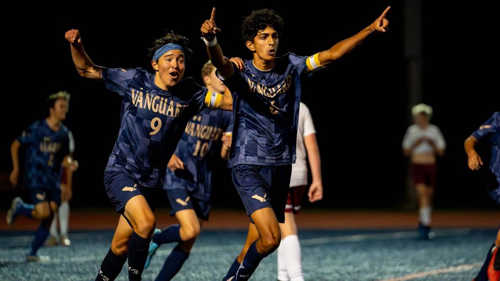 The Vanguard School boys soccer players celebrate a goal