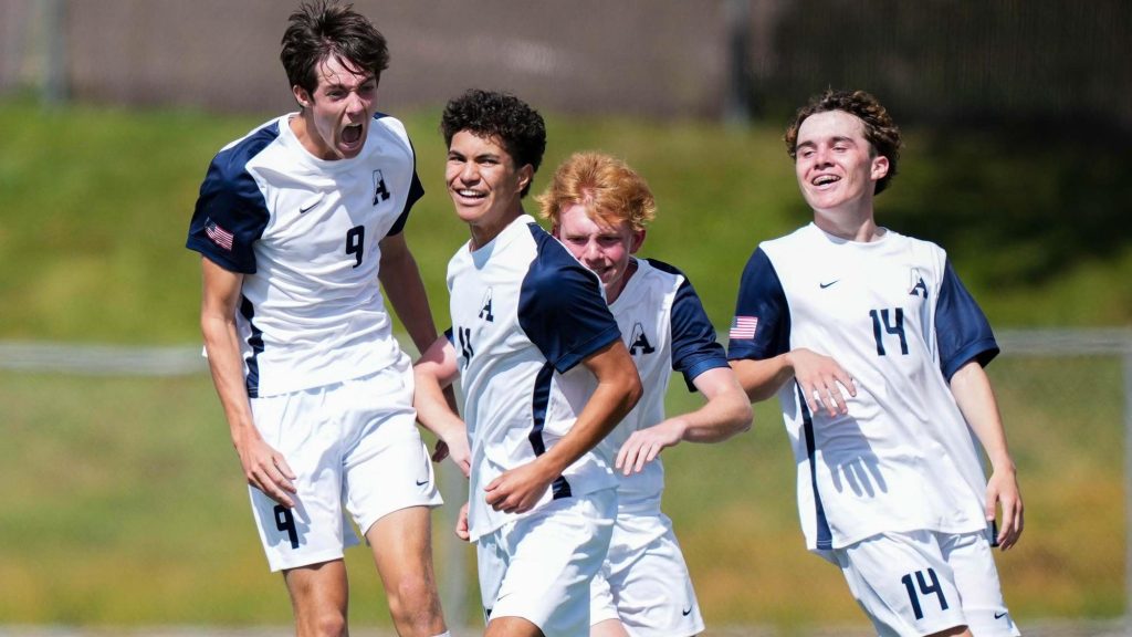 Air Academy boys soccer players celebrate