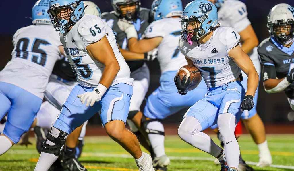 Zach Duran of Pueblo West runs with the football