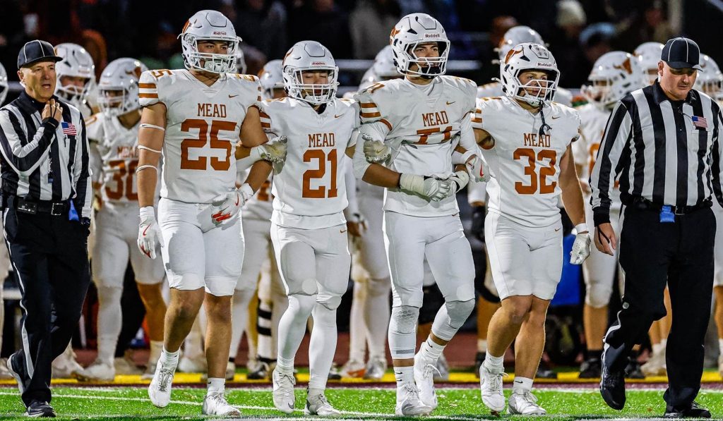 Mead captains walking to midfield for the coin toss