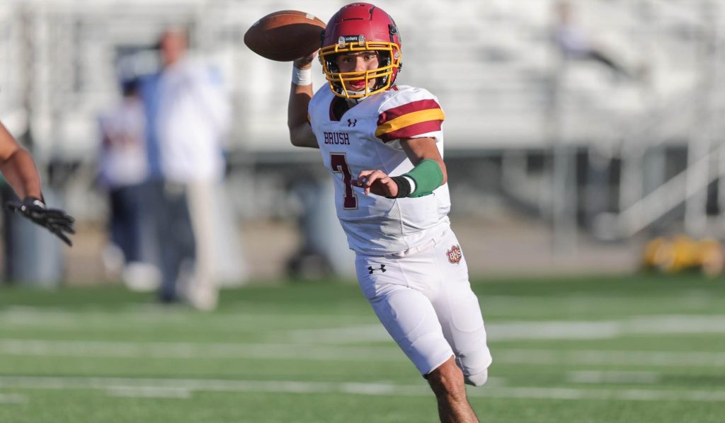 Brush football player Eric Rico prepares to throw a pass