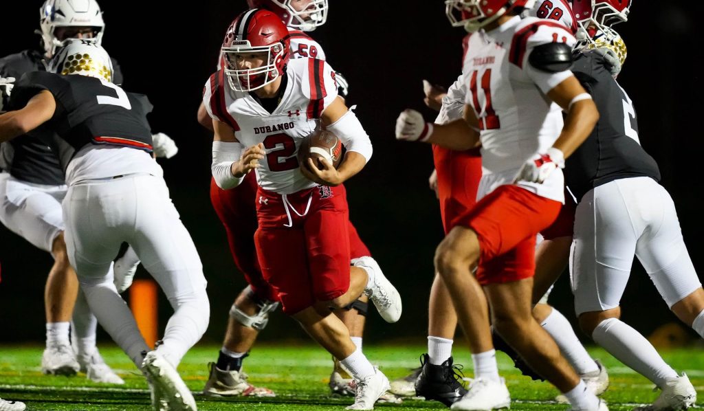 Durango's Gus Halls runs with the football