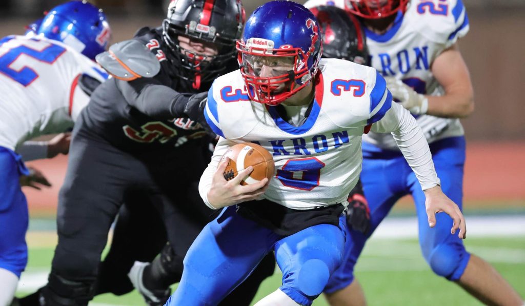 Jace Curtis of Akron runs with the football