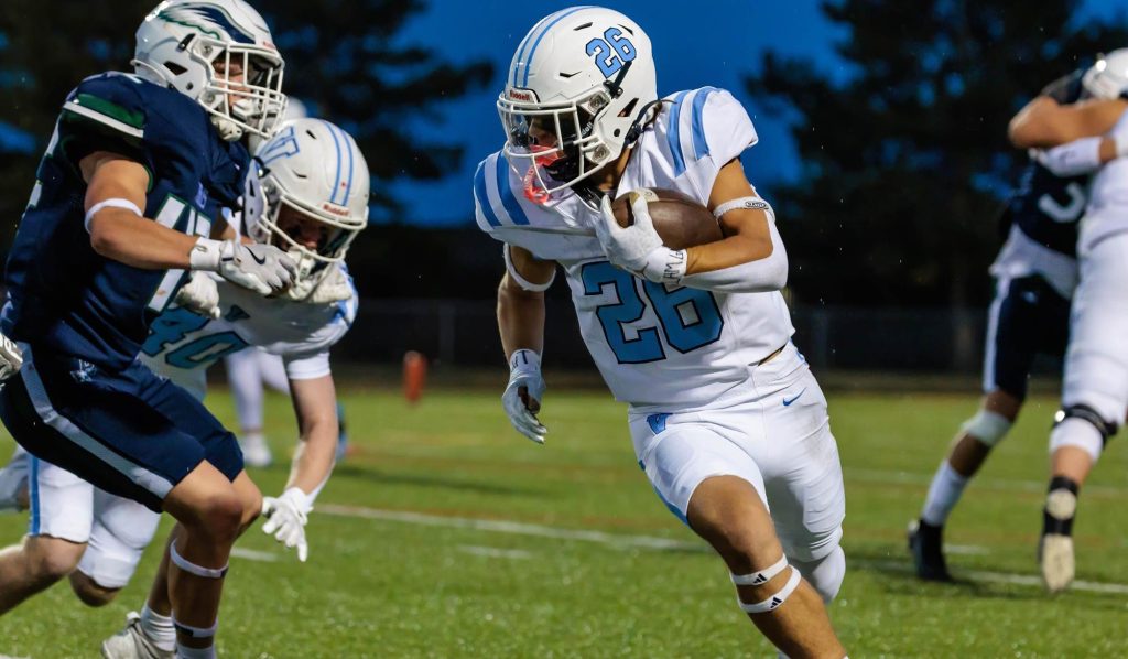Chase Hanosh of Valor Christian runs with the football.