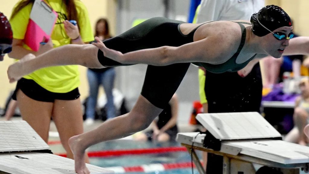 Monarch swimmer Audrey Shambo dives at the start of a race