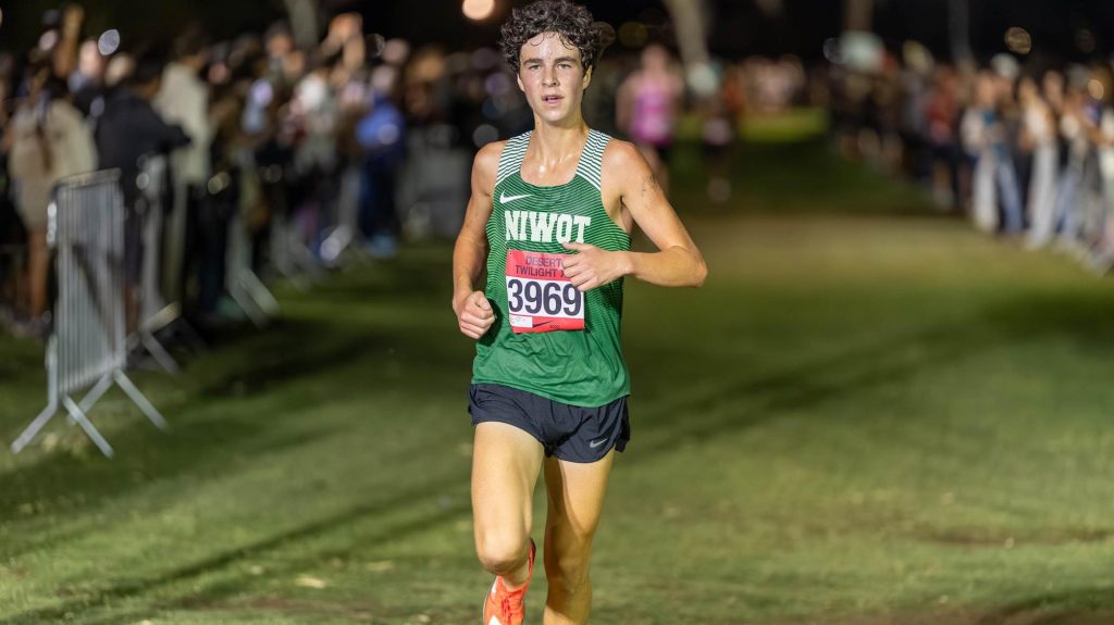 Niwot's Hunter Robbie finishing a cross country race