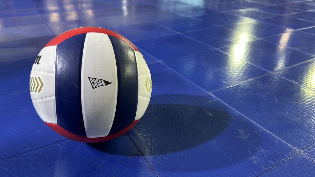 Volleyball on blue sportcourt