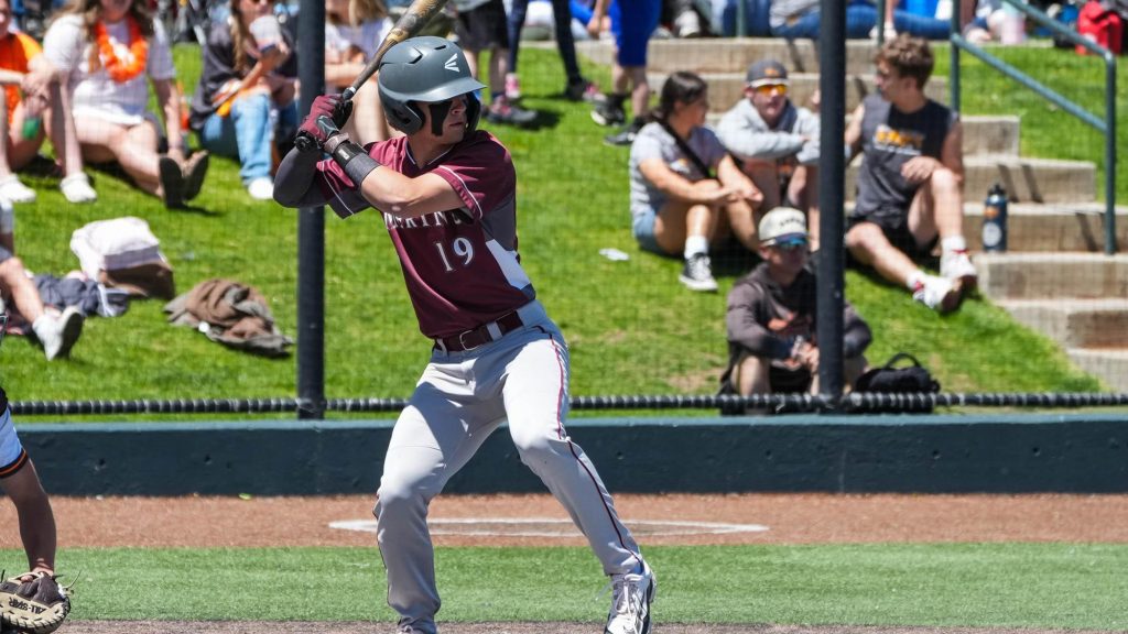Merino's Zachary Mackintosh at the plate in a baseeball game