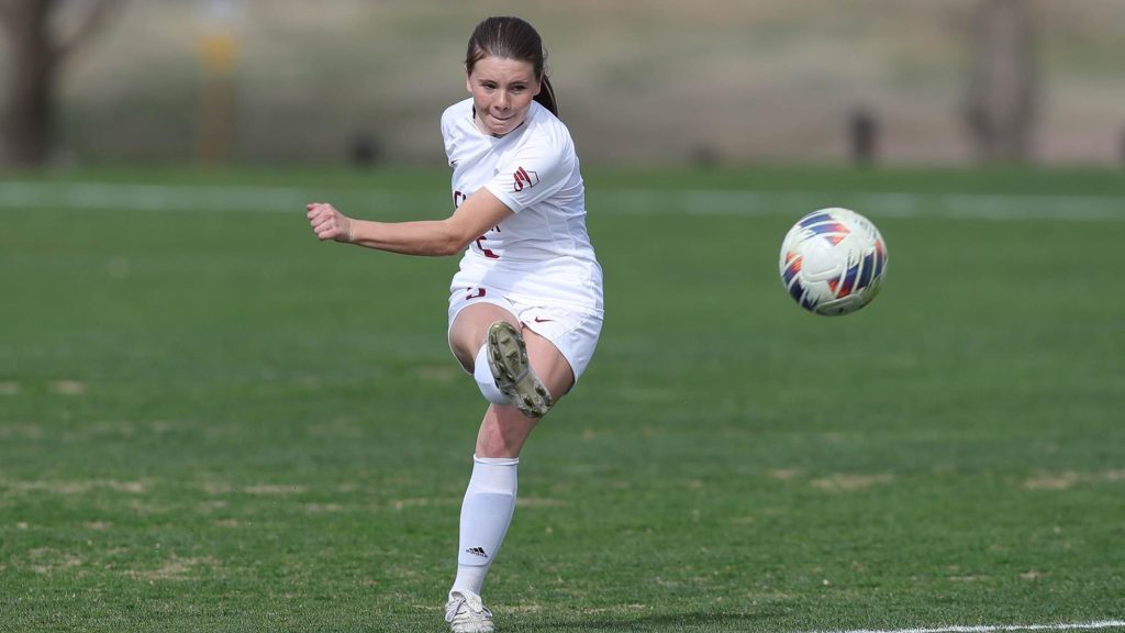 Emily Gilbert of Forge Christian following through after kicking the soccer ball